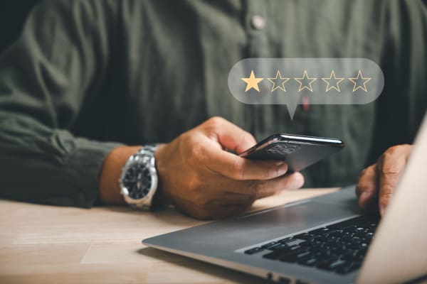 A business customer on a phone giving a 1 star review