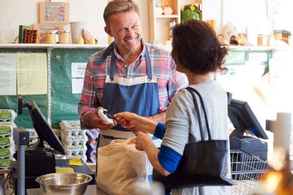 A customer at a small business making a purchase