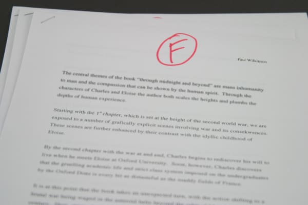 A school paper with a grade of F marked on it