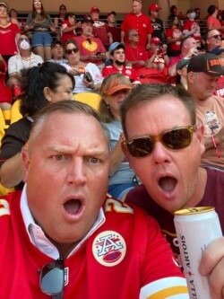 Aaron and Jeremy at a Chiefs' football game
