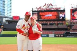 ES SEO Specialist Dani Neumann with St. Louis Cardinal Ozzie Smith