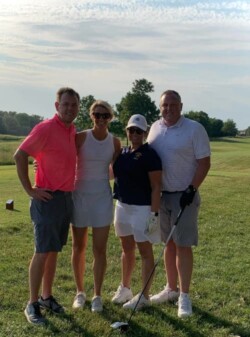 Aaron and Jeremy on a golf trip with their wives